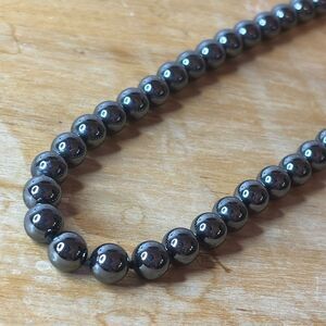 Vintage Black Hematite round beaded stone necklace with knotted thread 34”